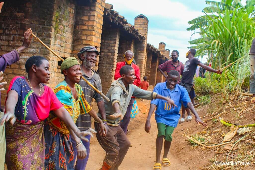 Pygmy meeting tourist in Burundi